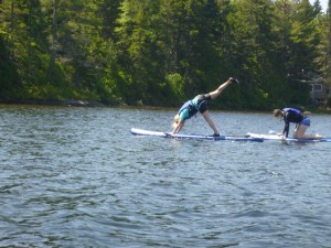 Person Doing Paddleboard Fitness on a Lake