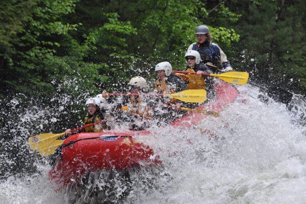 Whitewater Rafters Going Through Rough Water