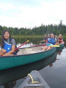 Kids at Summer Camp on a Canoe