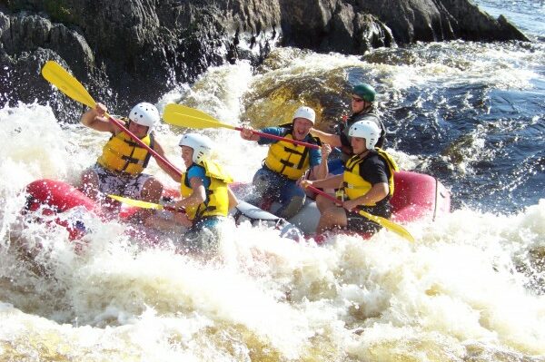 Whitewater Rafters Going Through Choppy Water