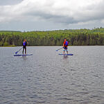 Two People Stand Up Paddle Boarding
